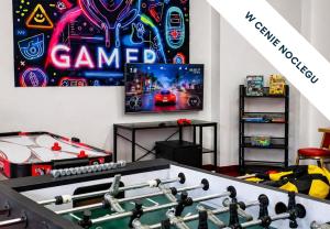 a room with a game room with a pool table at Prawdzic Family Resort & Wellness in Gdańsk