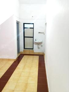 a bathroom with a sink and a toilet in it at Peace Villa with pool in Murud +46 photos