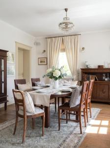 a dining room with a table and chairs at Golden Villas Luxury Garden Villa - Kraków in Węgrzce