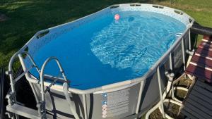 a pool in aroller with a swimming pool at La caravane de Camille & Piscine in Soulaires