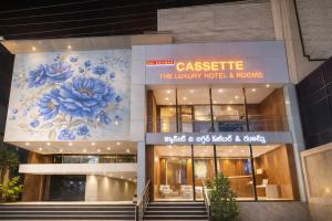 a building with a painting on the side of it at Cassette Inn in Zahirābād