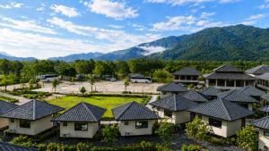 an aerial view of a resort with mountains in the background at Ranong Adventure Resort & Park in Ranong