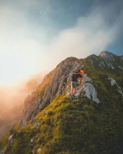 a couple of people standing on top of a mountain at Panorama Alm in Jochberg +12 photos