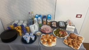 a table topped with plates of food and drinks at b&b Simpaty in Mondello +7 photos