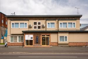 a building on the side of a street at べっどぷらす in Wakkanai