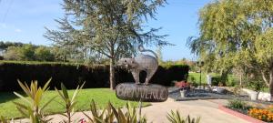 a statue of an elephant standing on a rock at L'Orée des Vignes 41 - Chambres d'hôtes in Saint-Georges-sur-Cher