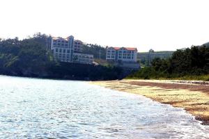 a body of water with buildings in the background at Byeonsanbando Jayjay Resort in Buan