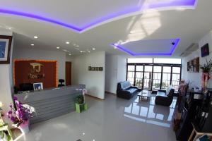 a lobby with purple lights on the ceiling at Byeonsanbando Jayjay Resort in Buan