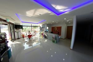 a large room with a purple lighting in a building at Byeonsanbando Jayjay Resort in Buan +12 photos