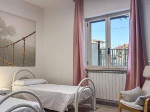 a hospital room with a bed and a window at Allombra della quercia in Ortona +13 photos