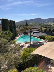 a swimming pool in a villa with a view at La Bastide des Dentelles in Roaix