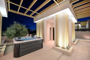 a large bathroom with a tub in the middle at Villa Stone in Smoković