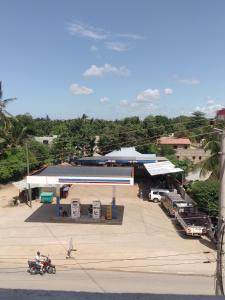 an overhead view of a gas station with a man on a motorcycle at Reenhomes in Kilifi