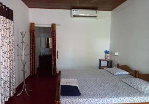 a bedroom with two beds in a room at MarariBeachLaVista1 in Alleppey