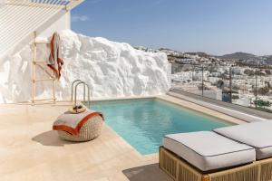 a swimming pool with a view of a mountain at Casa Kiku Mykonos in Mikonos