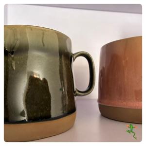 a mug that is sitting on a table at The Quiet Creative, Corporate-Ready 1BR in Tatu City +6 photos