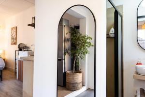 a kitchen with a refrigerator and a potted plant at Hilton Hideaway in Hilton +38 photos