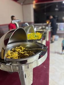 a buffet line of food in a food cart at Magic rum hussen Luxury in Wadi Rum