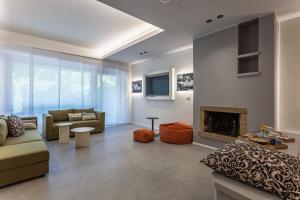 a living room with a couch and a fireplace at Velino Business Suite in Avezzano +22 photos