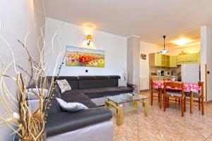 a living room with a couch and a table at House Pavicini 333 in Pavicini