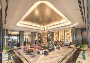 a lobby of a hotel with a large ceiling at Vivanta Vrindavan in Vrindāvan