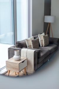 a living room with a couch and a coffee table at Modern 1Bed Flat in Ealing Near Tube & Shops in Ealing