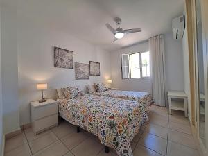 a bedroom with a bed and a window at Las Casitas de la Playa in Vera +76 photos