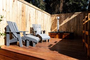 two chairs and a table on a wooden deck at Hilton Hideaway in Hilton