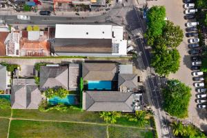 an overhead view of a house with a pool at M4YA Berawa in Canggu +14 photos