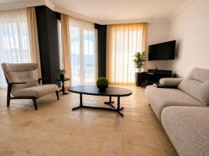 a living room with a couch and a table at Villa Yagmur in Kalkan