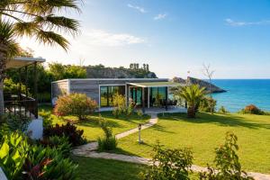 a house with a view of the ocean at Palm Beach Şile Villa Hotels in Şile