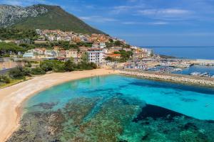 an aerial view of a beach and a city at Casa Del Marinaio in Cala Gonone