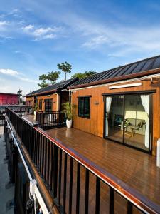 a house on a deck with a patio at NearBKKHomestayAirport in Bang Phli
