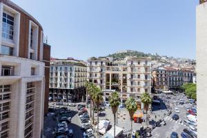 a city with cars parked in a parking lot at Toledo Apartment until 7 people 2 bathrooms in Naples