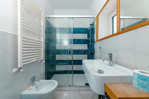 a bathroom with a sink and a glass shower at B&B Casa di Emma in Porto Cesareo +54 photos