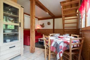 a dining room with a table and chairs at Chalet Chez Corinne in Cornimont +13 photos