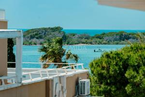 a view of the water from the balcony of a house at B&B Casa di Emma in Porto Cesareo