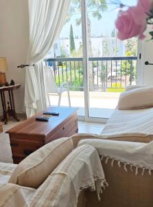 a bedroom with two beds and a window at Sunset Green 03 in Paphos +189 photos
