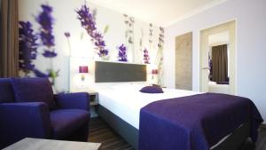 Postel nebo postele na pokoji v ubytování Garten-Hotel Ponick