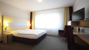 TV a/nebo společenská místnost v ubytování Garten-Hotel Ponick