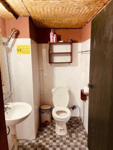 a small bathroom with a toilet and a sink at La Beauté Nghia Do in Nghĩa Ðô
