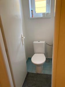 a bathroom with a white toilet in a room at Apartmány u Arény Ostrava in Ostrava +15 photos