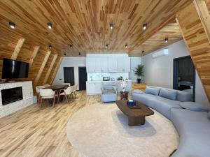 a living room with a blue couch and a table at SOLAR Hotel and Restaurant in Gabala