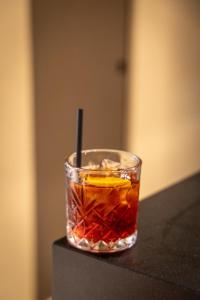 a drink in a glass sitting on a table at Ku Private Milano in Pero +57 photos