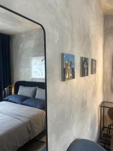 a mirror in front of a bedroom with a bed at Ema's double bedroom in Umag