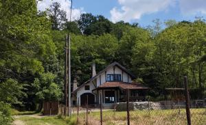 a white house in the middle of a field at villa vidalis in Veliko Golovode