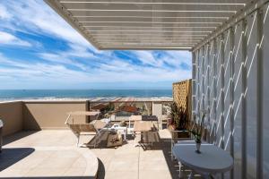 a balcony with a view of the ocean at Hotel Biagi & Residence in Lido di Camaiore