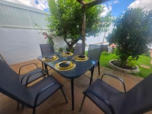 a blue table and chairs on a patio at Villa Mares in Casas Novas de Marés