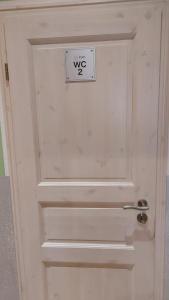 a door with a sign that says wxs on it at FineApartment Rendsburg in Rendsburg