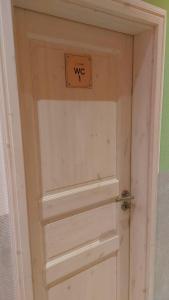 a door with a sign on top of it at FineApartment Rendsburg in Rendsburg